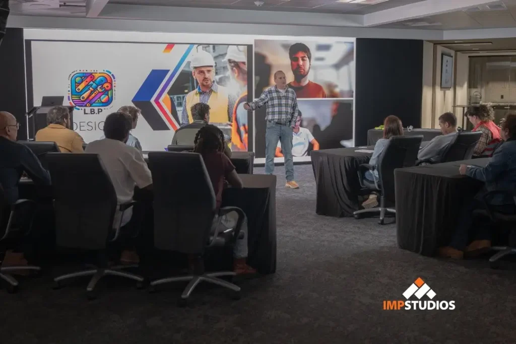Corporate training session filmed in NJ virtual production studio using LED wall for presentation visuals and audience engagement